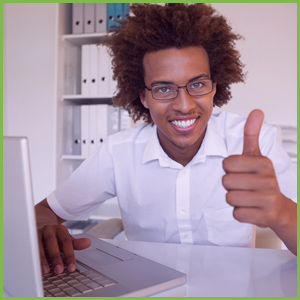 Thumbs Up Young Man Behind Laptop