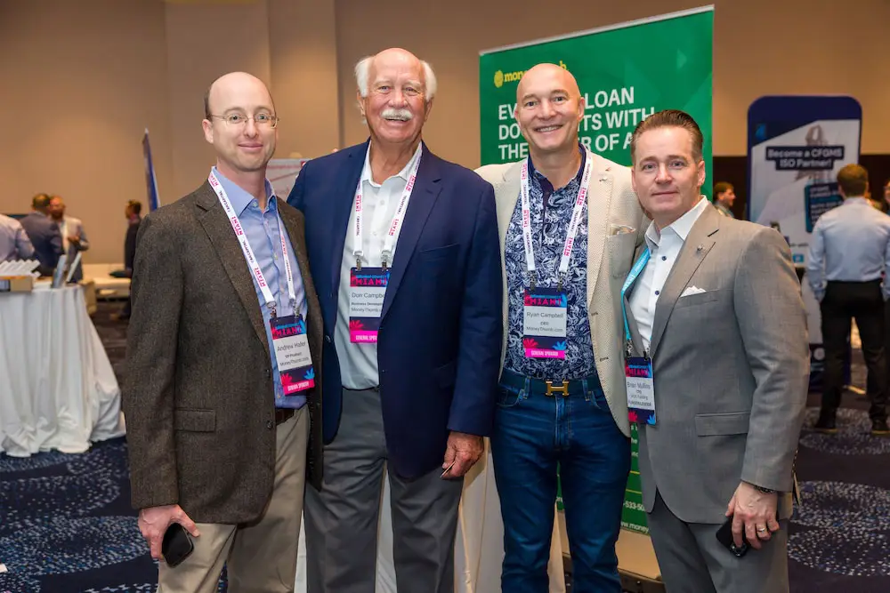DeBanked Miami 2026 with Andrew Don and Ryan in front of MoneyThumb booth at conference