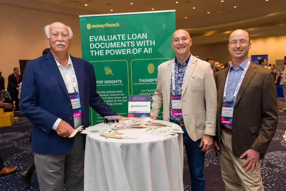 DeBanked Miami 2026 with Don Ryan and Andrew in front of MoneyThumb booth