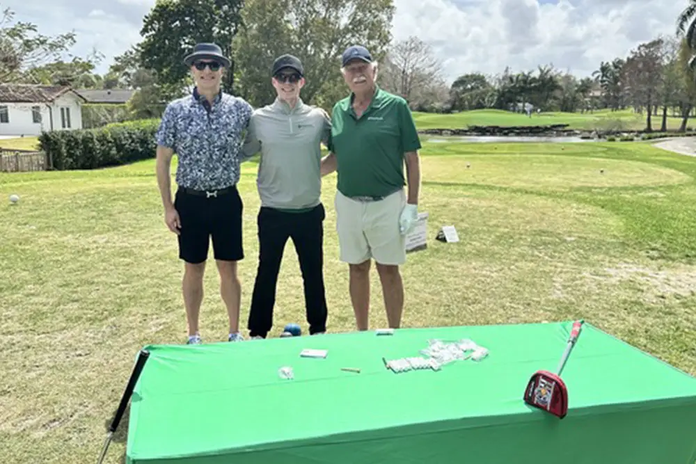Ryan Alex Don at Golf Course in Front of MoneyThumb Booth for Funders Forum and Brokers Expo 2026
