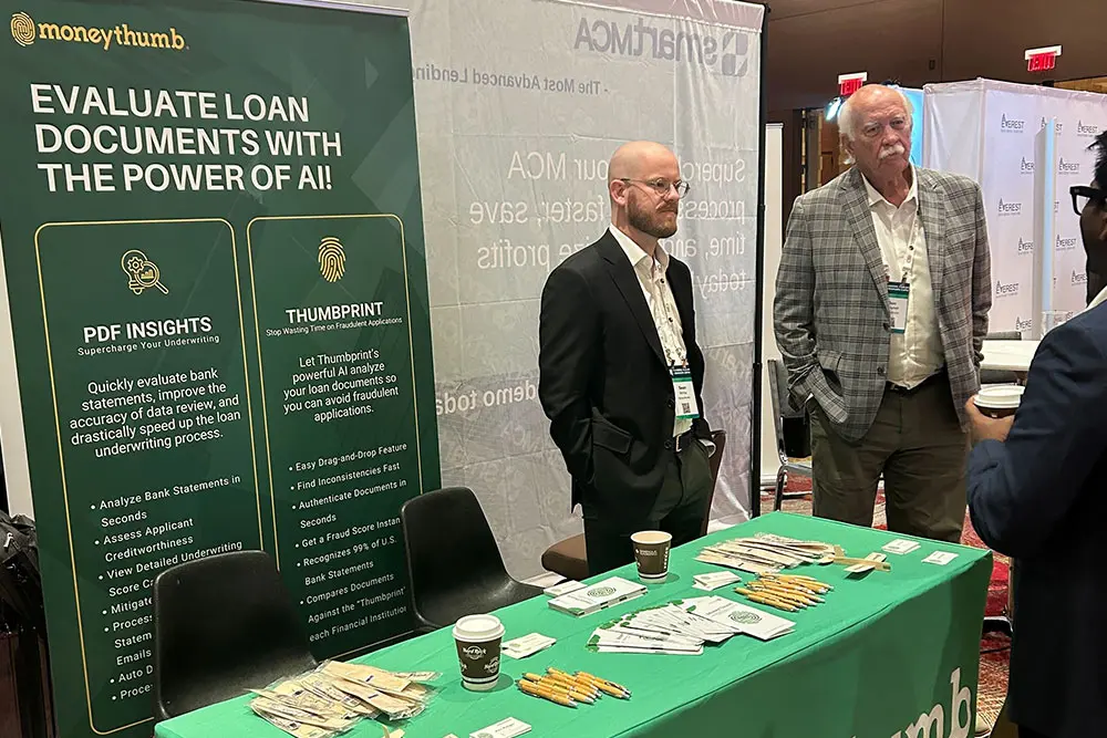 Sean and Don MoneyThumb Funders Forum Booth